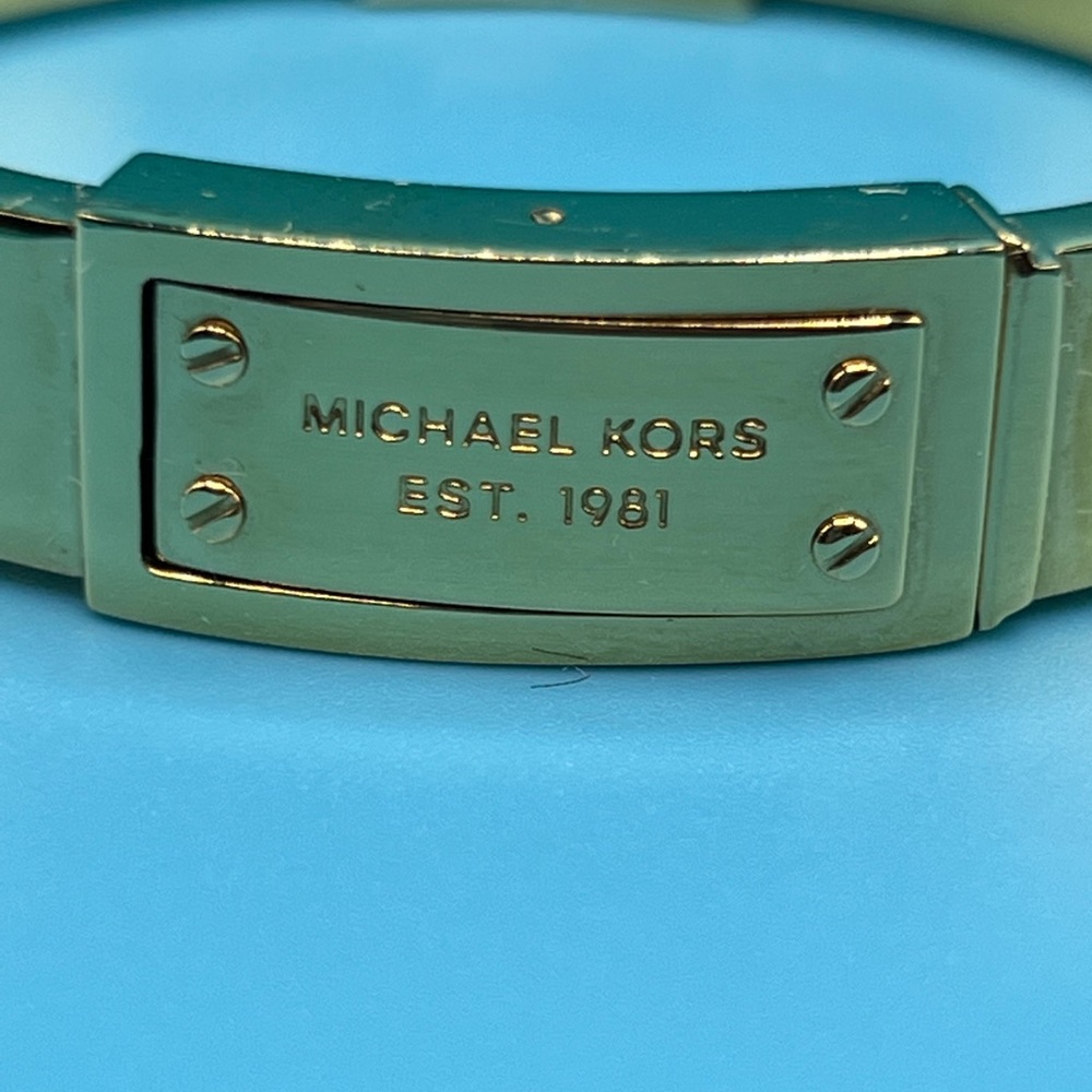 MK Gokd-Tone Engraved Plaque Bangle